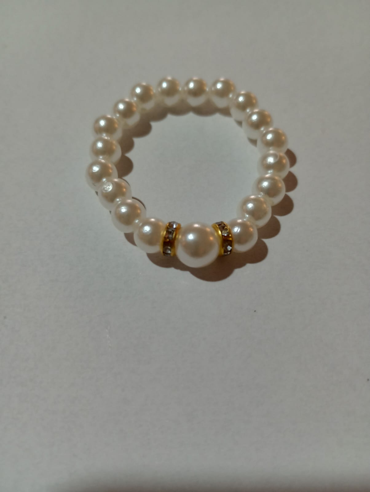 WhatsApp Image 2023-05-04 at 13.49.41 (2) Pingente Anel Perola Dourado - Imagem 1