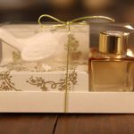 caixa aromatizador com frasco translucido e passarinho