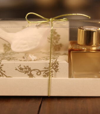 caixa aromatizador com frasco translucido e passarinho